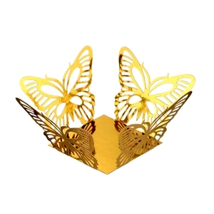 Macro shot of gold hollow butterfly decorative box with intricate laser cut floral lace