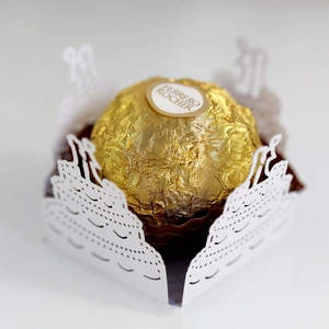 Laser-cut white hollow candy wrapper with angel silhouette for chocolate party decor