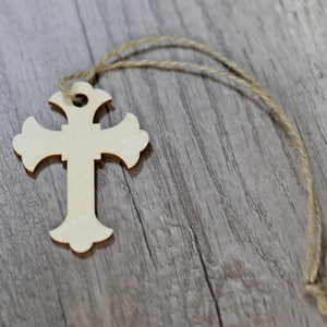 Handcrafted wooden cross tag with natural grain and hemp rope for holiday decor