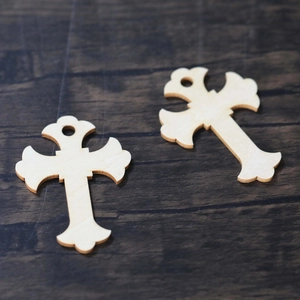 Detailed laser-cut wooden cross charms with decorative edges and pre-drilled holes