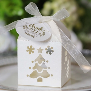 Detail of pearl white Christmas tree hollow candy box with silk ribbon and thank you tag