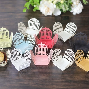 Laser-cut birdcage candy wrappers in various colors for elegant wedding chocolate favors
