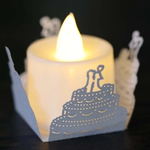 Detail of LED candle with laser-cut paper lampshade featuring romantic wedding silhouettes