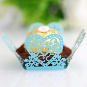 Detailed laser-cut light blue paper lace heart wrapper for chocolate and party favors