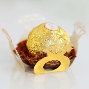 Detailed laser-cut gold diamond ring shape paper holder for chocolate wedding decor