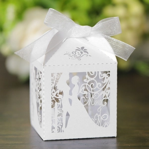 Detailed laser cut white candy box with bride groom silhouette and organza ribbon