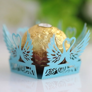Detailed laser-cut light blue swan chocolate holder with delicate hollow patterns