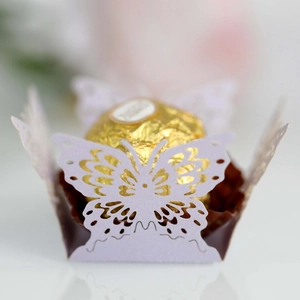 Detail of laser-cut butterfly candy box in lavender with chocolate inside
