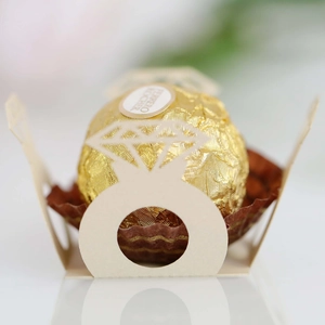 Detailed laser-cut paper chocolate holder with elegant hollow diamond ring design for weddings