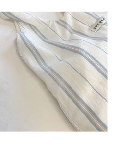 Close-up of canvas tote bag fabric with blue stripes and minimalist Korean text label