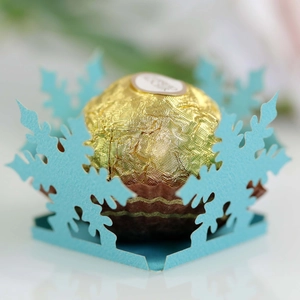 Laser-cut blue snowflake candy box for Christmas party with gold chocolate decoration