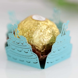 Detailed laser-cut light blue cupcake wrapper with wedding cake silhouette design