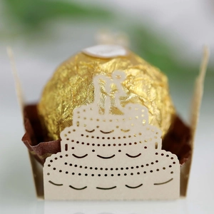 Detail of laser cut hollow cake wrapper for spherical chocolates in elegant beige paper