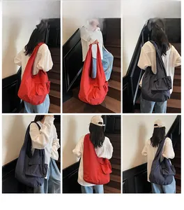 Detail view of large nylon tote bag with multi-pockets and waterproof shoulder strap