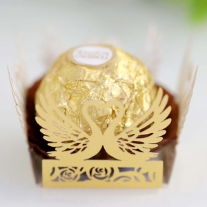 Detailed laser-cut gold swan heart-shaped chocolate wrapper for wedding favors