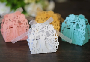 Laser cut wedding favor boxes with romantic silhouette and ribbon bows in four colors