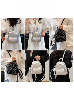 Mini zaino da donna in pelle PU floreale con spalline e ciondolo a palla di pelo
