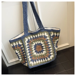 Detail of bohemian granny square crochet tote bag showing woven texture and inner lining