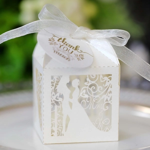 Detailed laser-cut white wedding candy box with Mr & Mrs design and a thank you tag