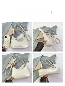 Detailed views of a white crescent shoulder bag with pearl chain and adjustable strap