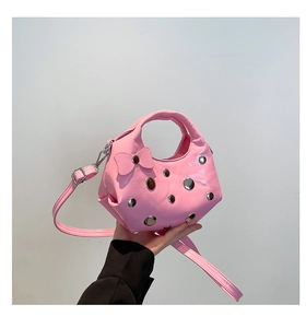 Pink crescent moon bag detail with silver rivets, butterfly bow and PU leather texture