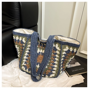 Detail of bohemian crochet tote bag featuring colorful sunflower patterns and cotton lining