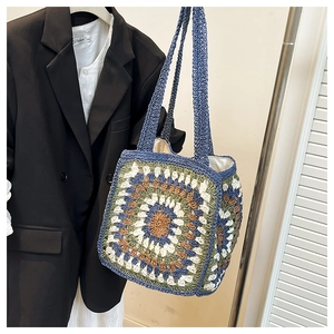 Detail of granny square crochet tote bag featuring vibrant geometric woven patterns