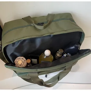 Macro view of army green travel bag interior showing large capacity for storage