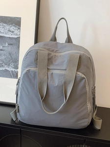 Mochila minimalista de nailon gris oscuro con gran capacidad y bolsillos multifunción