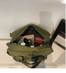 Top view of large capacity dark green travel bag showing spacious interior storage