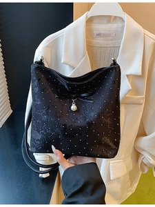 Elegant black velvet underarm bag with sparkling sequins, bow and pearl pendant