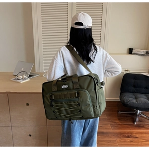 Army green large capacity travel bag with durable straps and functional pockets