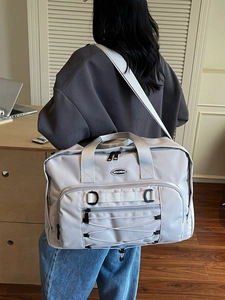 Large capacity travel crossbody bag in light khaki with adjustable shoulder straps