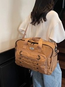 Large tan multi-functional travel duffle bag with adjustable straps and front pocket