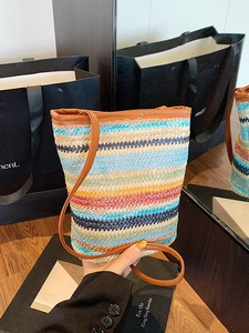 Colorful striped straw shoulder bucket bag with brown leather strap and woven texture
