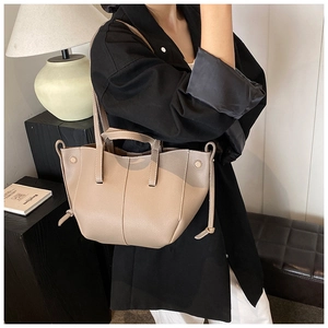 French chic tote bag in apricot pebble leather with decorative side drawstring detail
