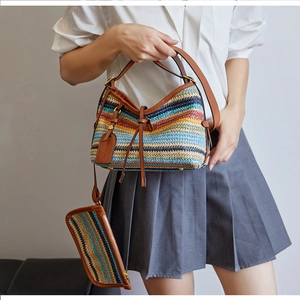 Rainbow woven straw handbag with adjustable leather shoulder strap and small pouch