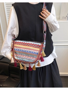 Bohemian woven crossbody bag featuring colorful ethnic tassels and geometric wide strap