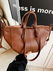 Brown lychee grain leather tote bag with white stitching and drawstring detail