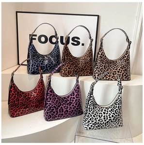 Collection of vibrant leopard print hobo bags in various colors with glossy finish