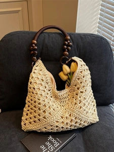 Handmade woven tote bag with wooden bead handle and floral hollow pattern for summer
