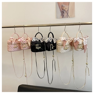 Mini quilted crossbody bags with silk scarf handles and gold ball charms in three colors