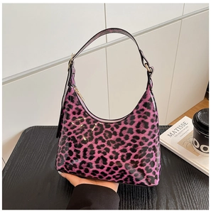 Detail view of purple leopard print hobo bag with glossy finish and metal zipper