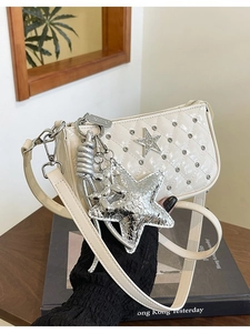 Quilted cream crossbody bag with sparkling rhinestones and silver star pendant