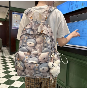 Close-up of cute cartoon bear and flower prints on durable nylon backpack fabric