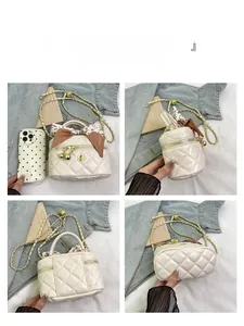 Detailed views of beige quilted crossbody bag with silk scarf and chain strap