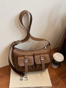 Brown PU leather hobo bag with multi-pocket design and adjustable shoulder strap