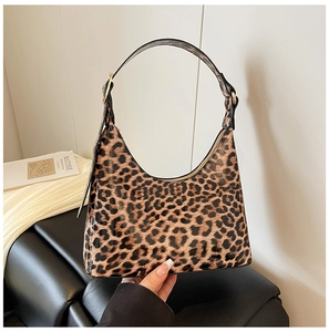 Detail showing the leopard print hobo bag texture and elegant golden zipper hardware