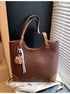 Large brown lychee textured tote bag with contrast handles and cute bear pendant