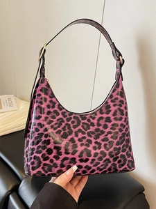 Stylish leopard print half-moon underarm bag with pink patent leather and gold buckle